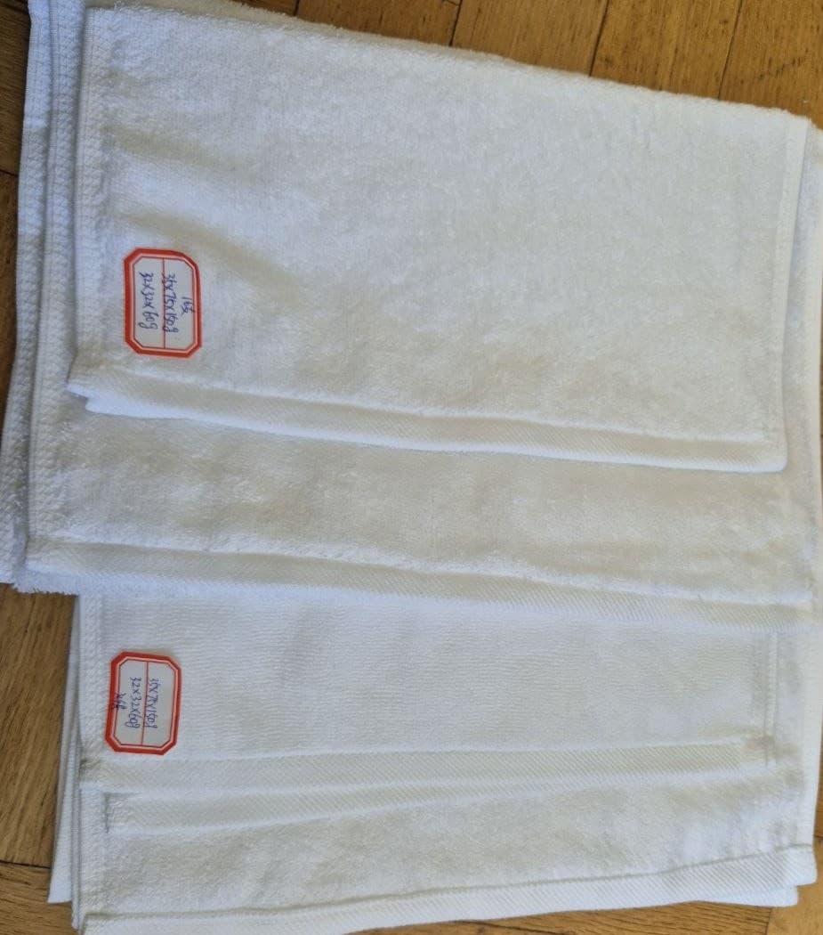 Embroidered hotel bath towels stacked