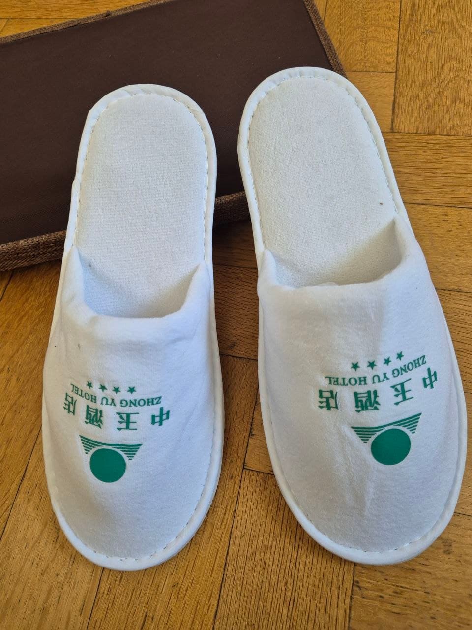 Vense velvet hotel slippers near rattan basket